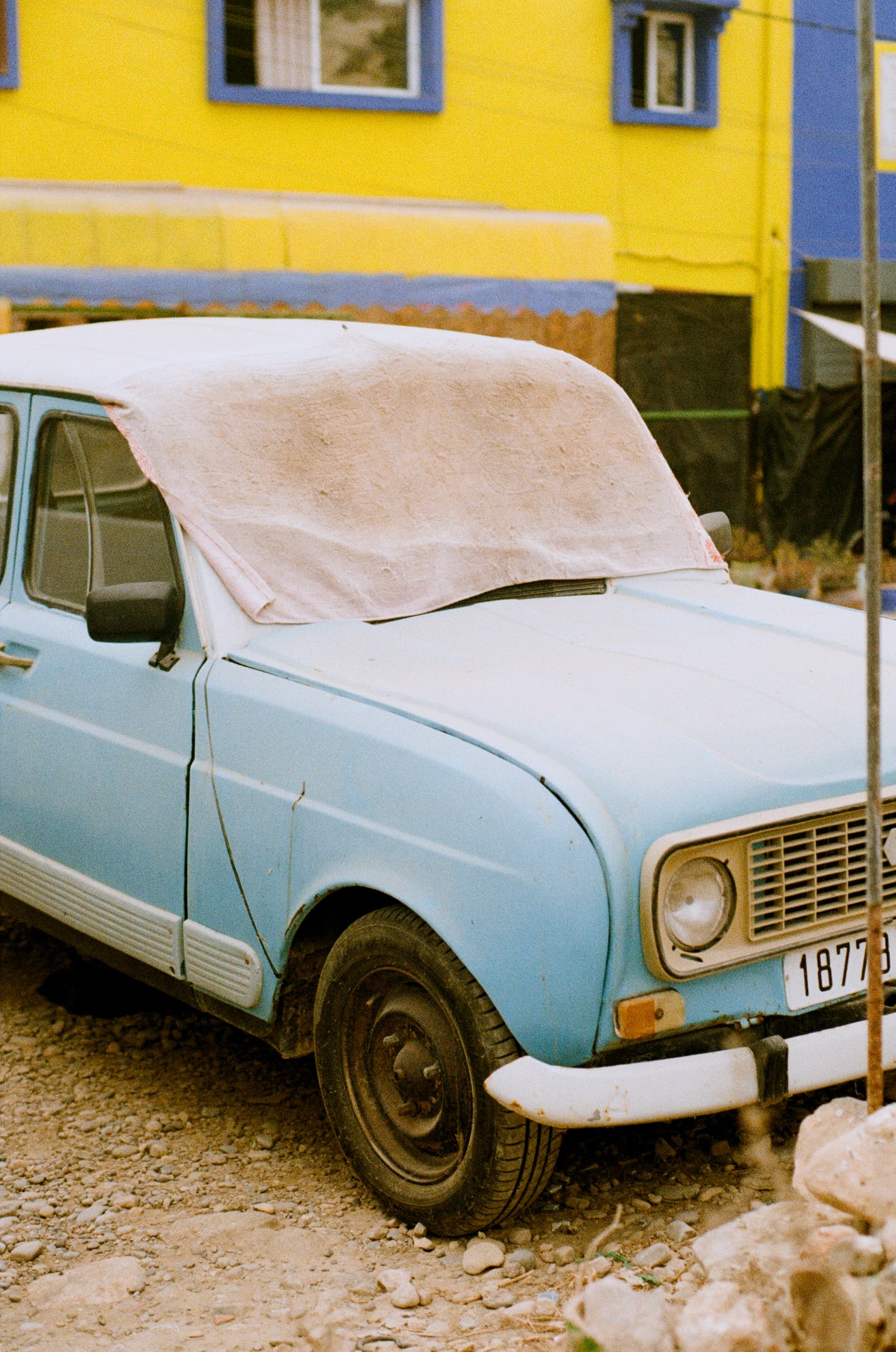 An Old Blue Renault Keeping Cool
