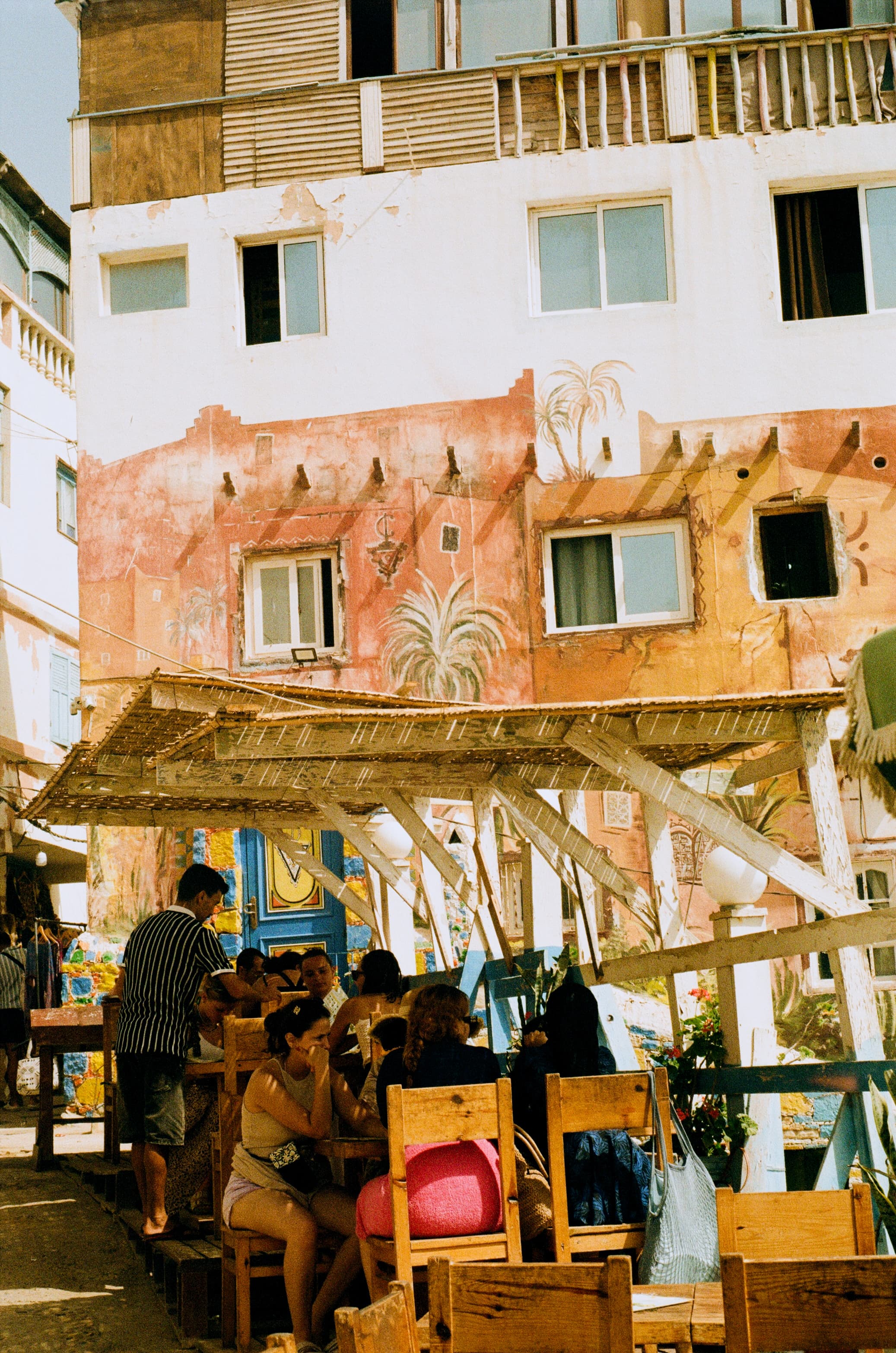 Lunch Beneath the Painted Palms